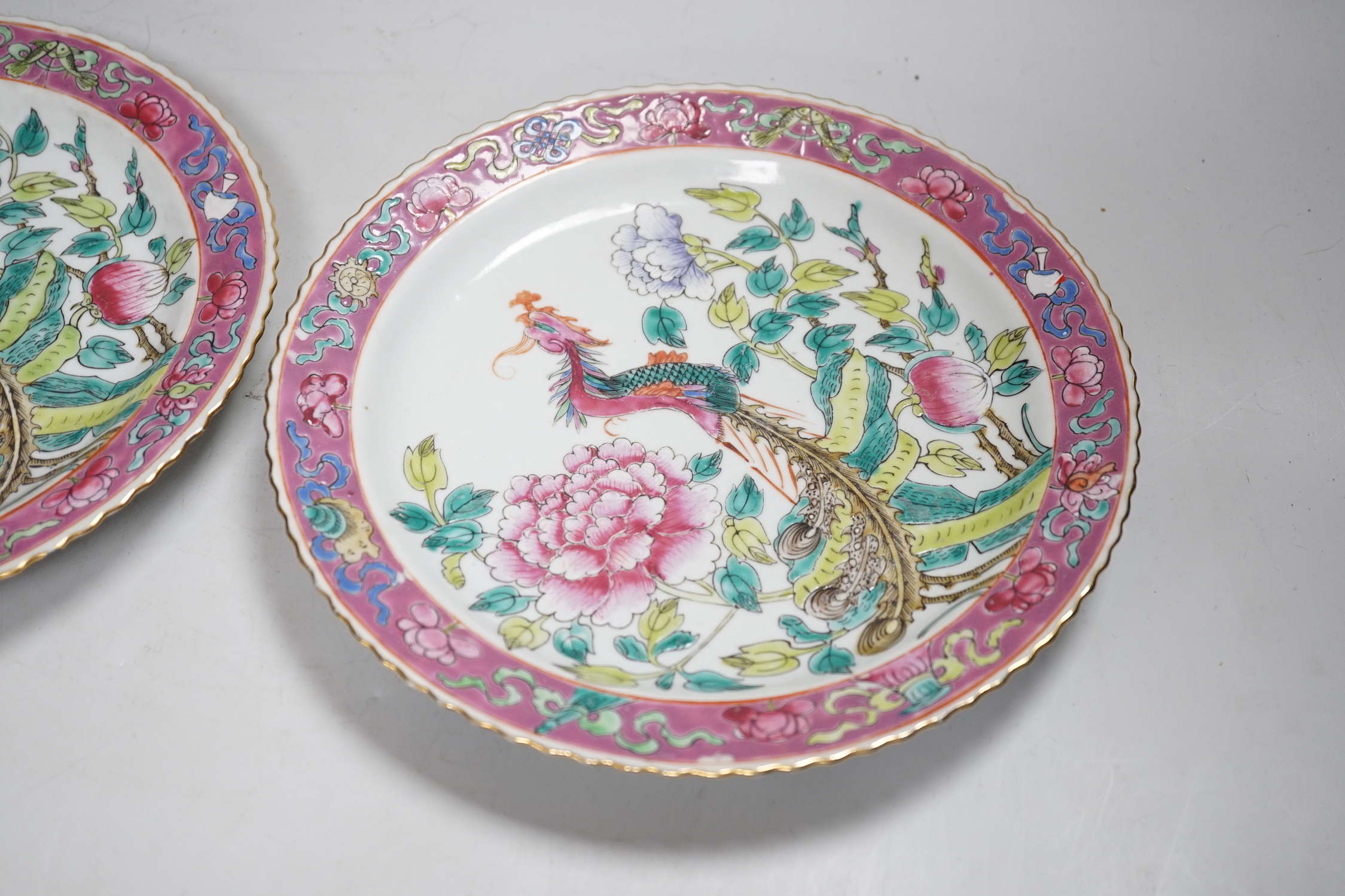 A pair of Chinese Straits famille rose plates for the Malaysian market, 23cm diameter